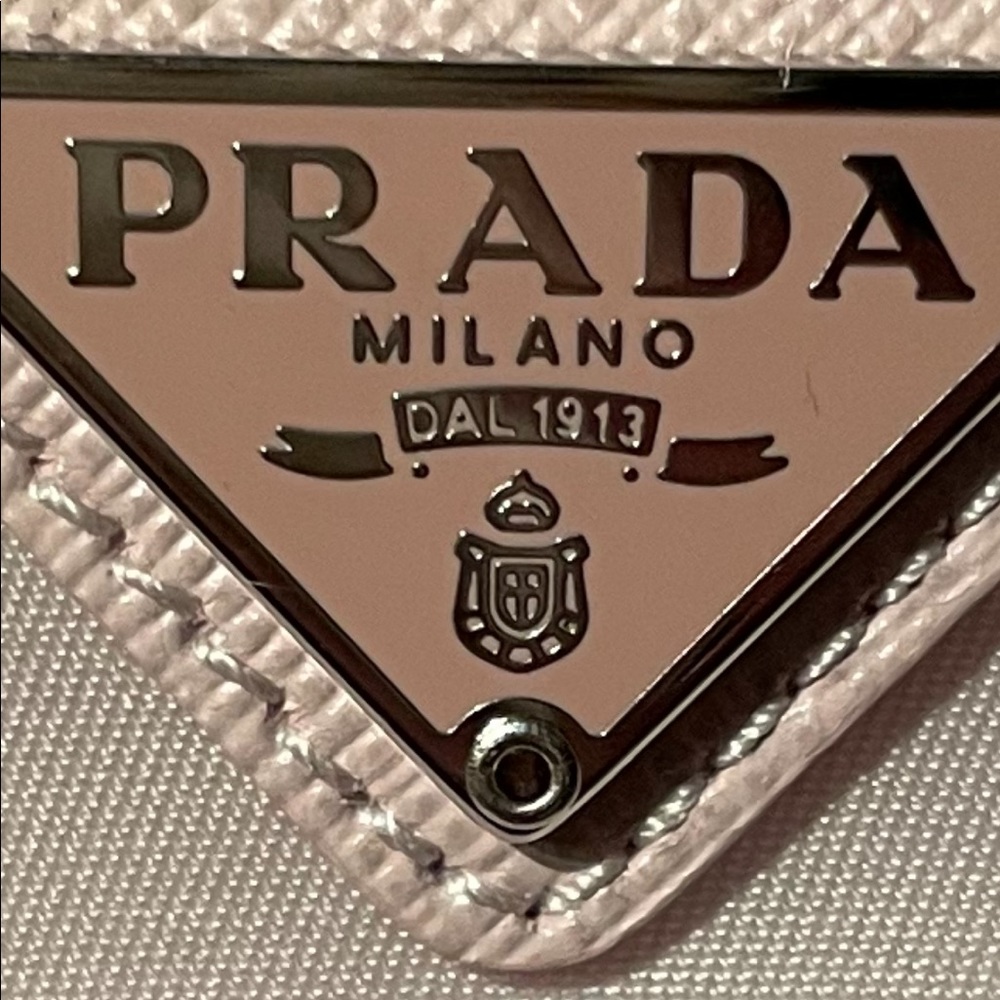 How to spot a fake Prada! Photo 1 is real 2 fake